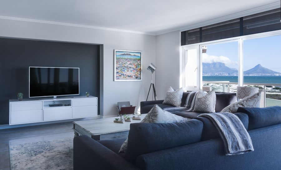 Soft daylight entering a refined interior through tall windows