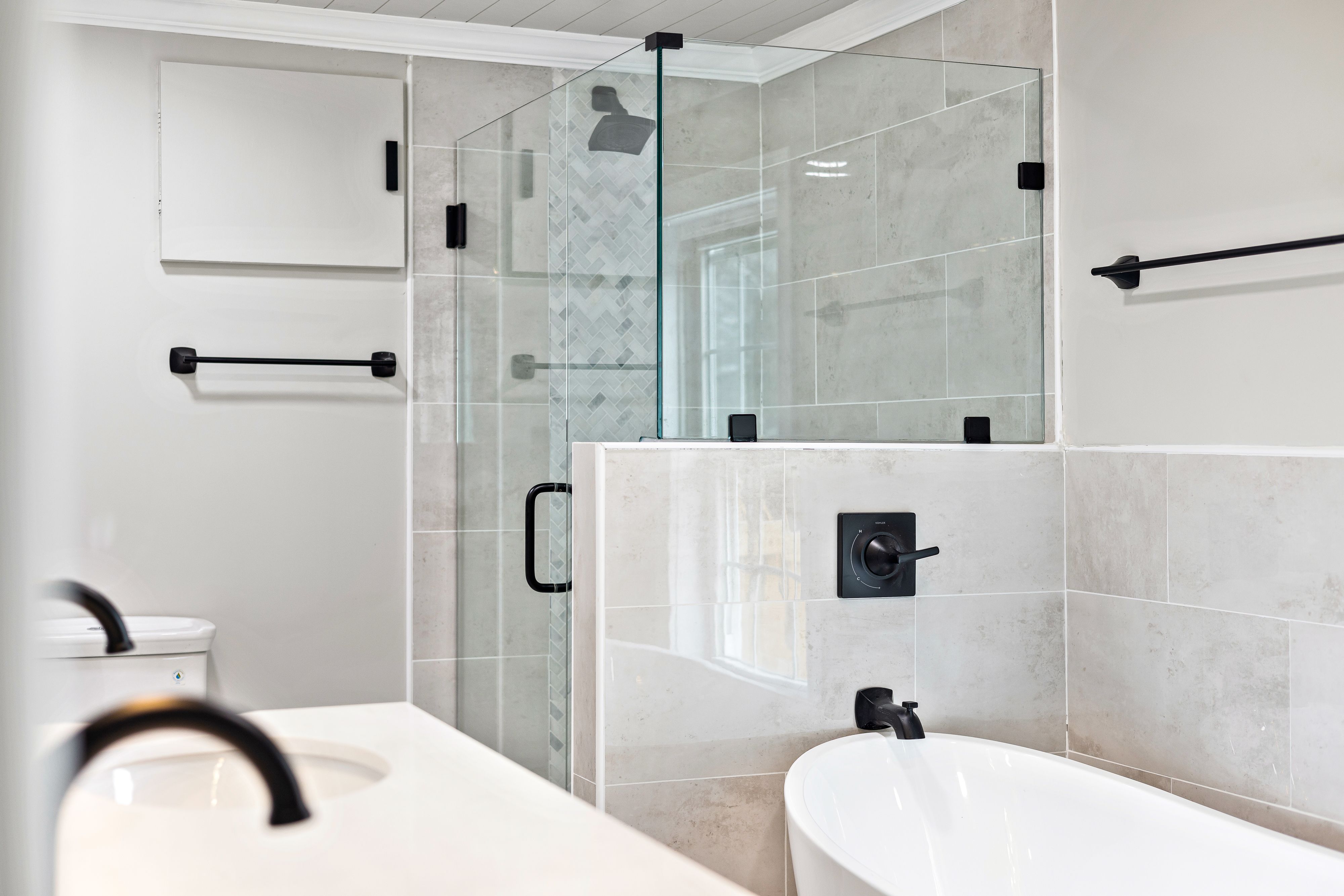 Refined bathroom with neutral tiles and soft ambient light
