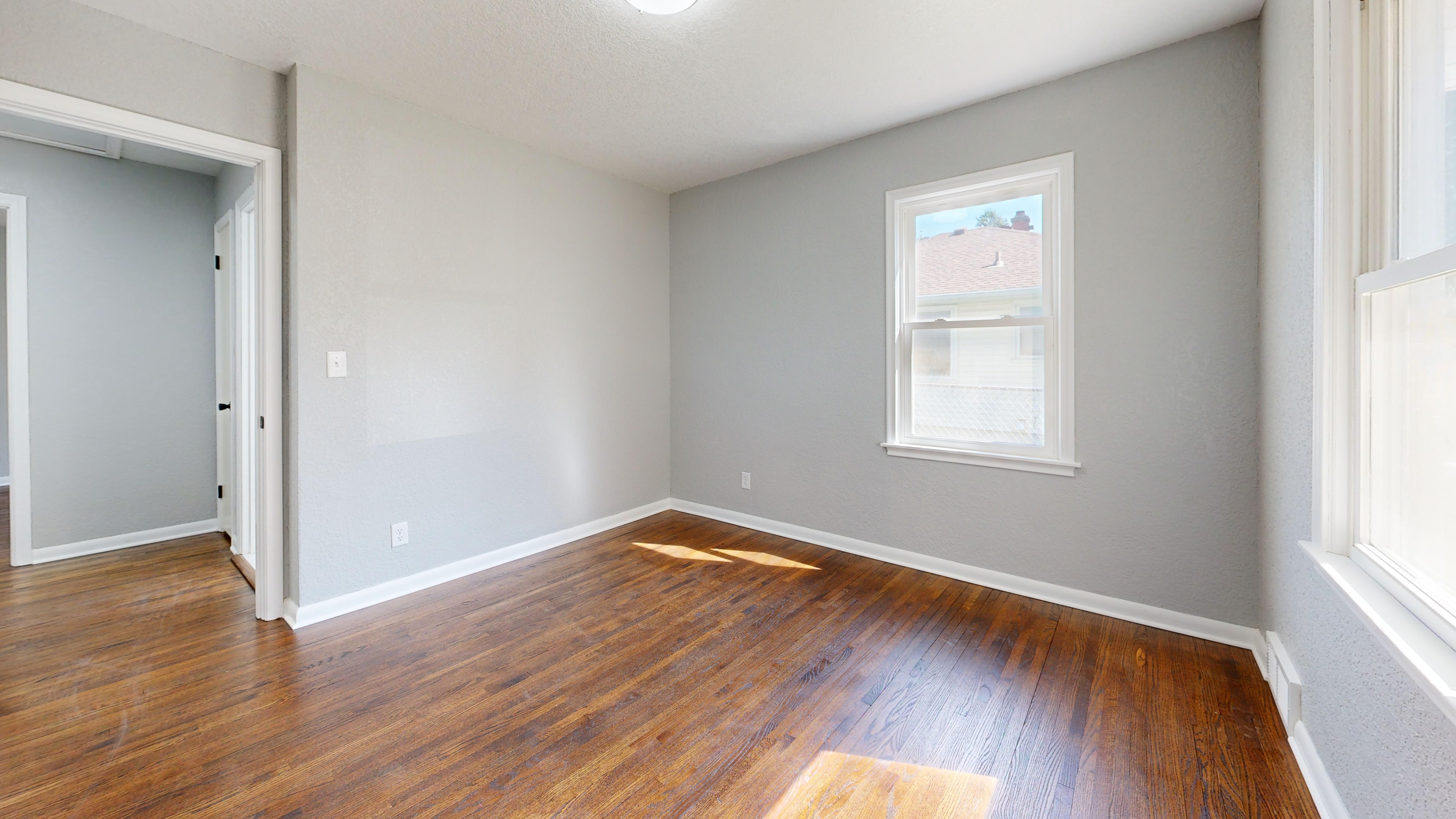 Hardwood flooring installation with precise plank alignment