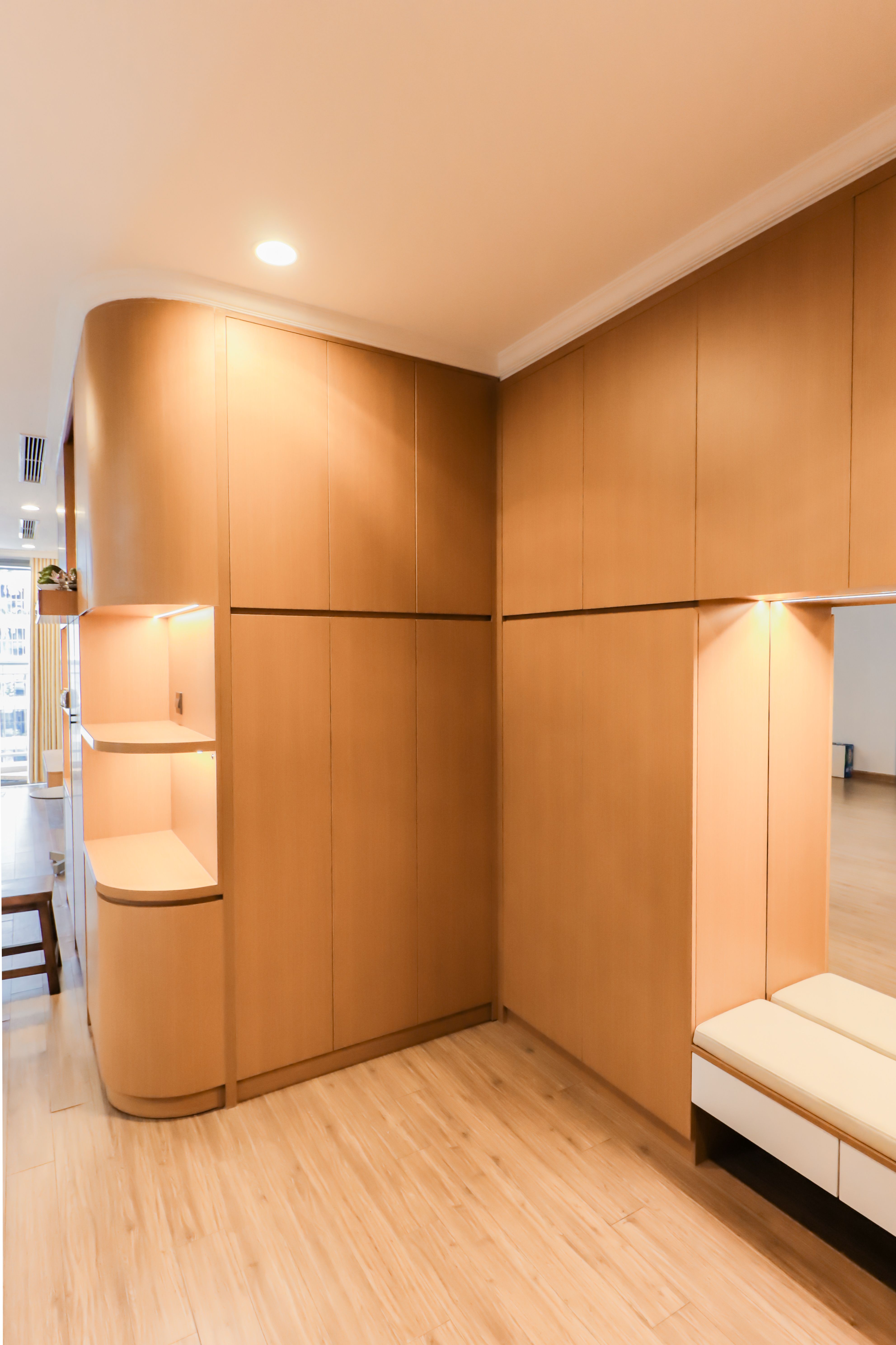 Interior with integrated shelving and layered ambient lighting